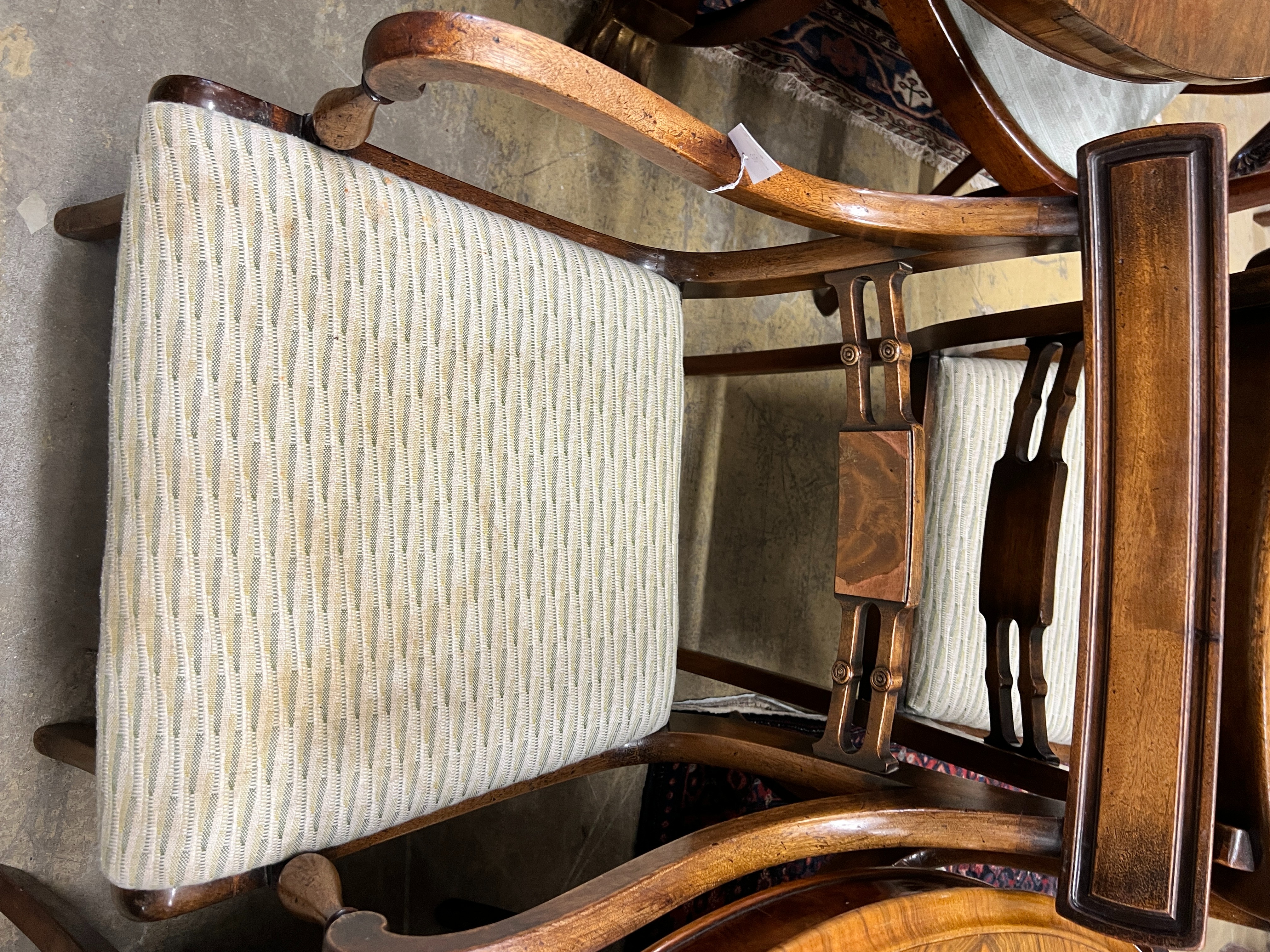 A set of six Regency style mahogany dining chairs, two with arms